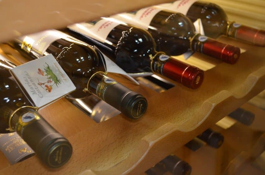 Store your bottles in a wine rack with corks on their side. 